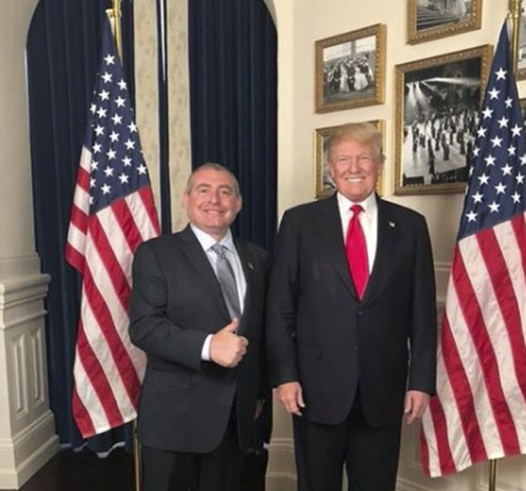 This Facebook screen shot provided by The Campaign Legal Center, shows President Donald Trump standing with Lev Parnas, top left photo, at the White House in Washington, posted on May 1, 2018. (The Ca ...