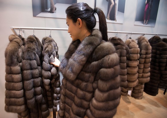epa04636655 A model wears a fur coat at the Hong Kong International Fur and Fashion Fair 2015, in Hong Kong, China, 25 February 2015. According to traders at the show, 90 percent of fur produced in fu ...