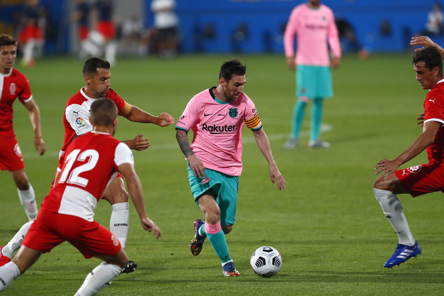 Barcelona&#039;s Lionel Messi, centre, in action during the pre-season friendly soccer match between Barcelona and Girona at the Johan Cruyff Stadium in Barcelona, Spain, Wednesday, Sept. 16, 2020. (A ...