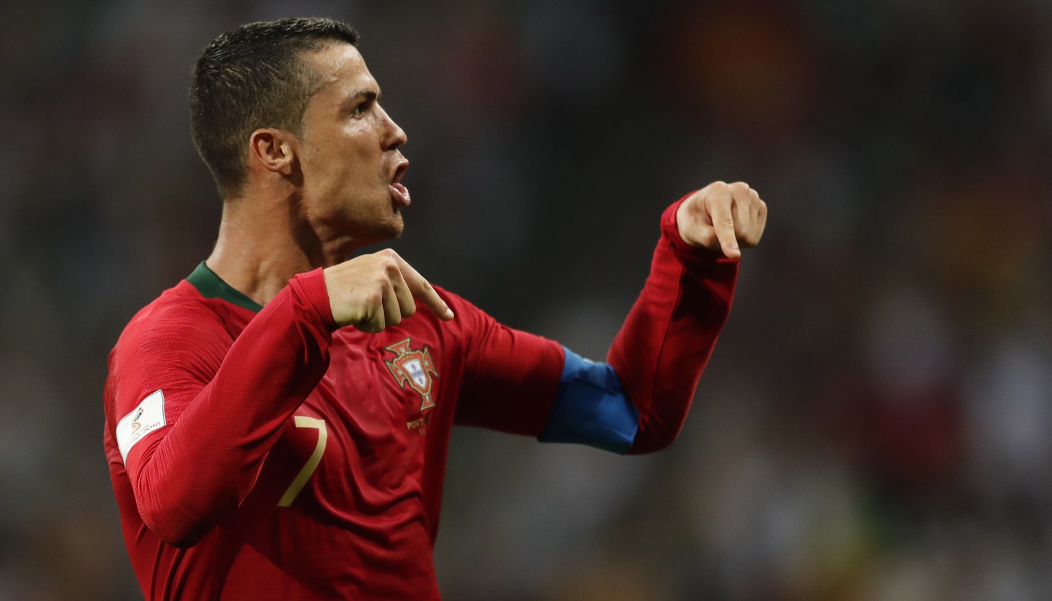 epa06811559 Cristiano Ronaldo of Portugal celebrates after scoring the 3-3 goal during the FIFA World Cup 2018 group B preliminary round soccer match between Portugal and Spain in Sochi, Russia, 15 Ju ...