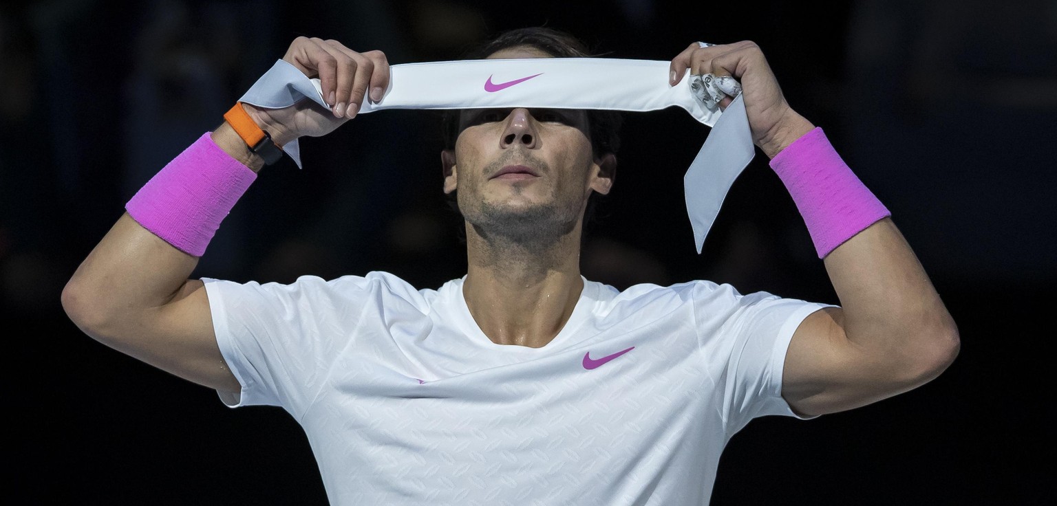 191114 -- LONDON, Nov. 14, 2019 -- Rafael Nadal of Spain adjusts his head band during the singles group match against Daniil Medvedev of Russia at the ATP, Tennis Herren World Tour Finals 2019 in Lond ...