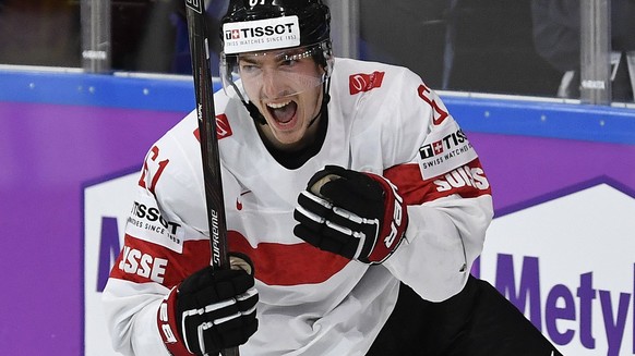 epa05962321 Switzerland’s Fabrice Herzog celebrates after scoring the winning goal during the IIHF Ice Hockey World Championship 2017 group B preliminary round game between Canada and Switzerland, in  ...