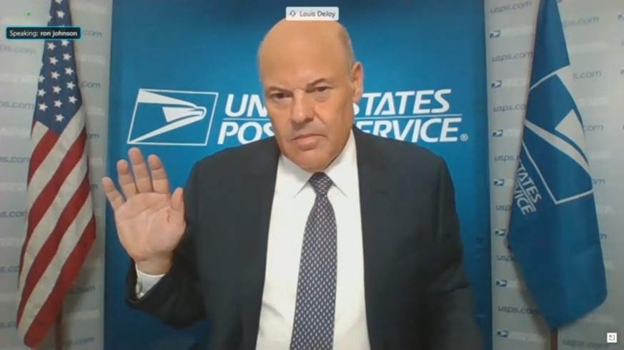 epa08616351 A frame grab from video made available by the Senate Homeland Security and Governmental Affairs Committee (HSGAC) shows Louis DeJoy, Postmaster General of the United States Postal Service, ...