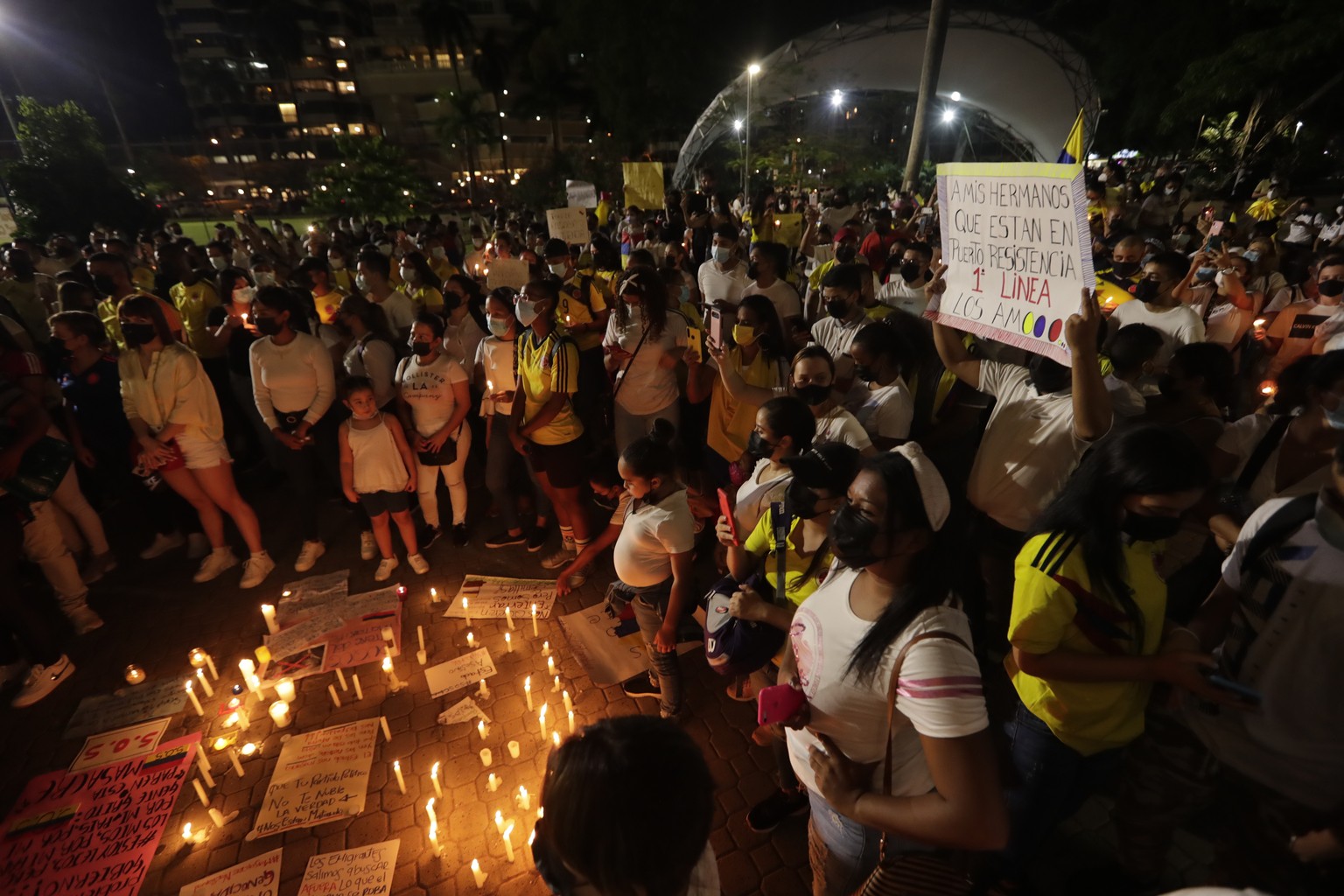 Colombians living in Panama gather during vigil in Panama City, Wednesday, May 5, 2021. The vigil is in support of protests that began last week over a tax reform proposal, and that continue despite P ...