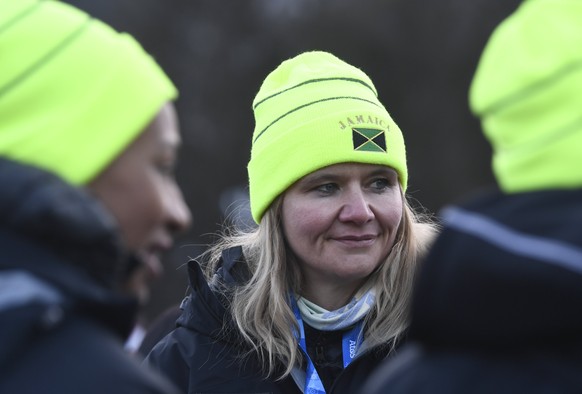 epa06502091 Coach of Jamaican boblsleigh team, retired German bobsledder Sandra Kiriasis (C) reacts during the official team welcome ceremony at the PyeongChang Olympic Village before the start of the ...