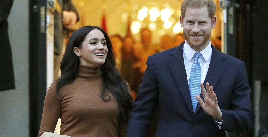 FILE - In this Jan. 7, 2020, file photo, Britain&#039;s Prince Harry and Meghan, Duchess of Sussex leave Canada House in London. Six months after detangling their work lives from the British royal fam ...
