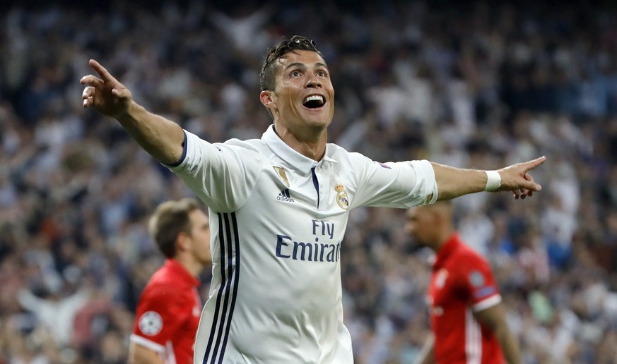 epa05914161 Real Madrid&#039;s Portuguese Cristiano Ronaldo celebrates after scoring against Bayern Munich during the Champions League quarter finals second leg soccer match between Real Madrid and Ba ...