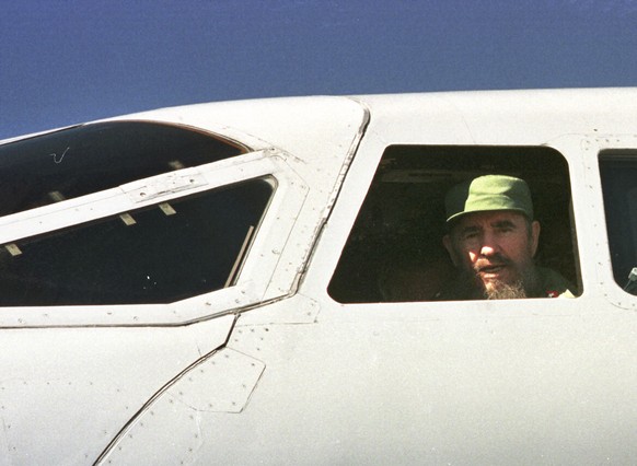 FILE - In this Dec. 31, 1997 file photo, Cuba&#039;s leader Fidel Castro peers from the window of the Concord aircraft during a stop in Havana, Cuba. Castro has died at age 90. President Raul Castro s ...