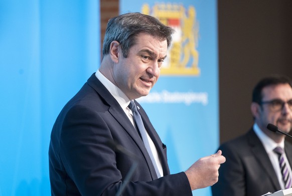 epa09091511 Bavaria&#039;s state premier Markus Soeder speaks during to a press conference after a meeting of the Bavarian cabinet in Munich, Bavaria, Germany, 23 March 2021. Germany extended and stre ...