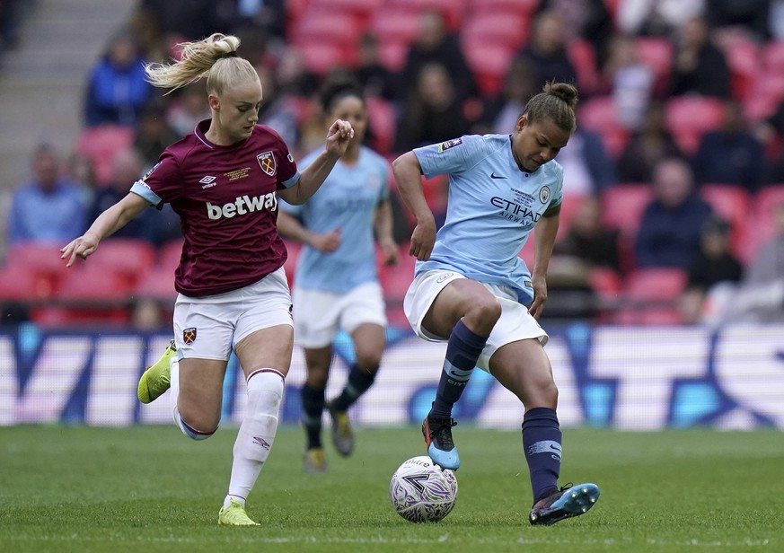 West Ham&#039;s Alisha Lehmann, left, and Manchester City&#039;s Nikita Parris battle for the ball during the Women&#039;s FA Cup Final at Wembley Stadium, London, Saturday May 4, 2019. (John Walton/P ...