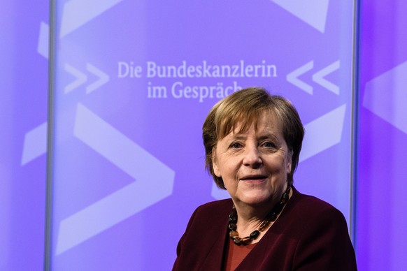 epa09065389 German Chancellor Angela Merkel looks on prior to the beginning of a video conference of the digital dialog series &#039;The Federal Chancellor in Conversation&#039; (Die Bundeskanzlerin i ...