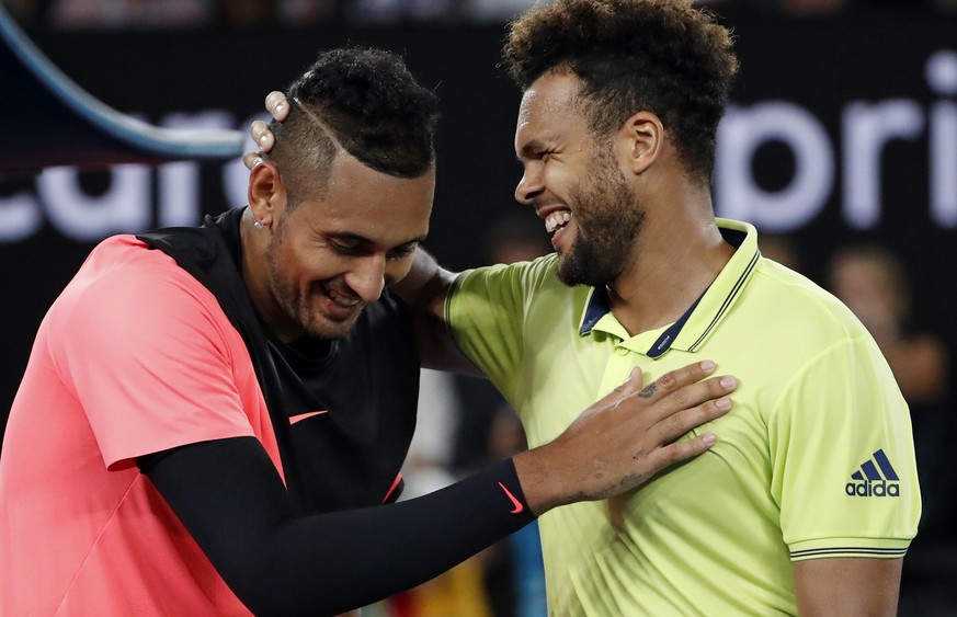 France&#039;s Jo-Wilfried Tsonga, right, congratulates Australia&#039;s Nick Kyrgios after Kyrgios won their third round match at the Australian Open tennis championships in Melbourne, Australia, Frid ...