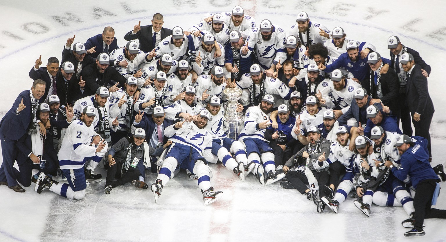 Tampa Bay Lightning players celebrate their Stanley Cup win over the Dallas Stars at the NHL Stanley Cup hockey finals in Edmonton, Alberta, on Monday, Sept. 28, 2020. (Jason Franson/The Canadian Pres ...