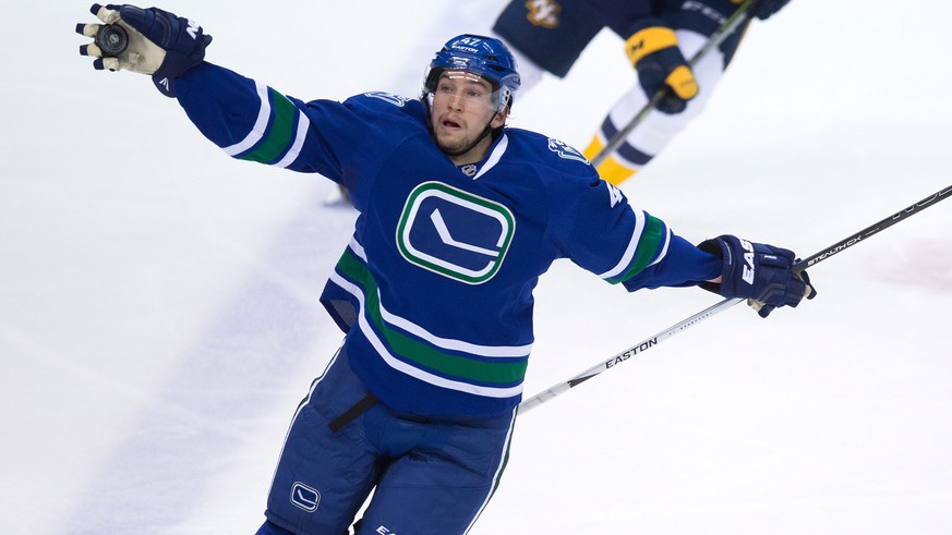 Vancouver Canucks&#039; Sven Baertschi, of Switzerland, grabs the puck out of the air during second period NHL hockey action against the Nashville Predators in Vancouver, British Columbia, Tuesday, Ja ...