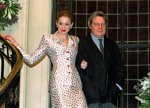 FILE - Actress-singer Madonna arrives for a news conference about the musical film &quot;Evita&quot; with British director Alan Parker in Buenos Aires on Feb.6, 1996. Parker, whose movies included