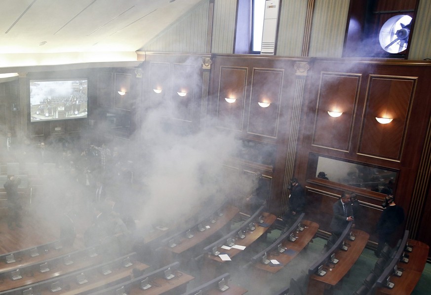 epa05182024 Opposition lawmakers throw tear gas during an extraordinary session to elect the new Kosovo&#039;s President at Kosovo&#039;s parliament in Pristina, Kosovo, 26 February 2016. The session  ...