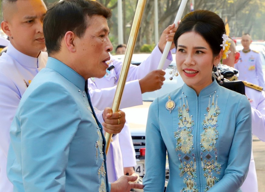 epa08965750 epa08965743 Thai King Maha Vajiralongkorn Bodindradebayavarangkun (L) accompanied by the Royal Consort Sineenat Wongvajirapakdi (R) attend a merit-making ceremony to mark the Royal Consort ...
