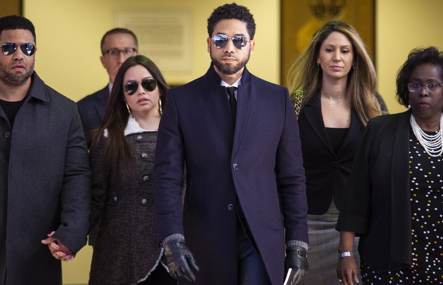 Actor Jussie Smollett, center, leaves the Leighton Criminal Courthouse in Chicago after prosecutors dropped all charges against him on Tuesday, March 26, 2019. (Ashlee Rezin/Sun-Times/Chicago Sun-Time ...