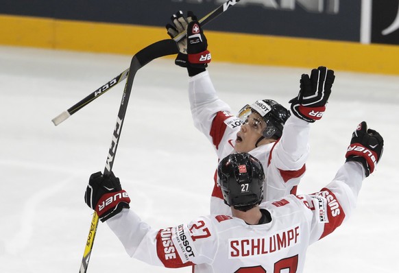 Switzerland&#039;s Suri Reto, back, celebrates with teammate Dominik Schlumpf, front, after scoring his sides second goal during the Ice Hockey World Championships group B match between Czech Republic ...