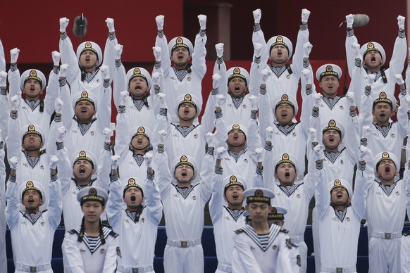 epa07521150 Chinese People&#039;s Liberation Army (PLA) navy soldiers perform during the multinational naval military bands performance to celebrate the upcoming 70th anniversary of the Chinese PLA Na ...