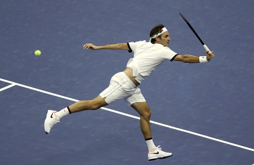 Roger Federer, of Switzerland, returns a shot to Damir Dzumhur, of Bosnia, during the second round of the US Open tennis championships Wednesday, Aug. 28, 2019, in New York. (AP Photo/Kevin Hagen)