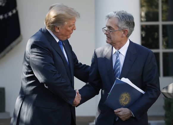 President Donald Trump shakes hands with Federal Reserve board member Jerome Powell after announcing him as his nominee for the next chair of the Federal Reserve, in the Rose Garden of the White House ...