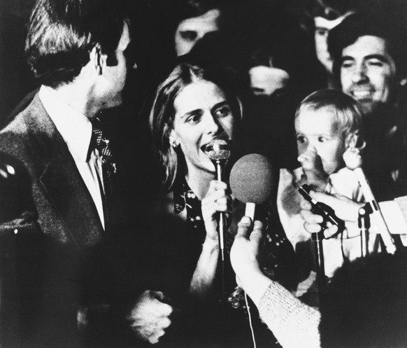 FILE - In this Nov. 7, 1972, file photo, Sen.-elect Joseph Biden, left, gives the microphone to his wife, Neilia Biden, center, in Wilmington, Del. Mrs. Biden and her daughter, Amy Biden, whom she is  ...