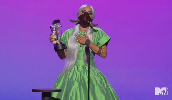 In this video grab issued Sunday, Aug. 30, 2020, by MTV, Lady Gaga accepts the award for song of the year for &quot;Rain On Me&quot; during the MTV Video Music Awards. (MTV via AP)
