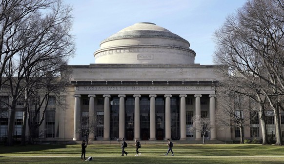 FILE - In this April 3, 2017 file photo, students walk past the &quot;Great Dome&quot; atop Building 10 on the Massachusetts Institute of Technology campus in Cambridge, Mass. Two prominent researcher ...