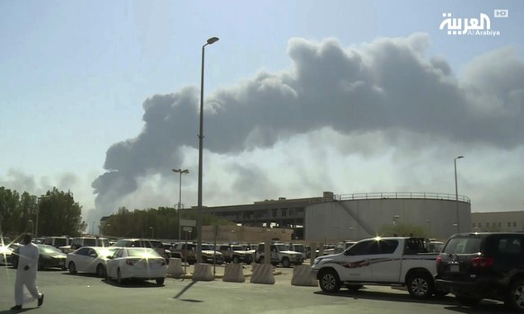 FILE - In this Saturday, Sept. 14, 2019 file photo, made from a video broadcast on the Saudi-owned Al-Arabiya satellite news channel, smoke from a fire at the Abqaiq oil processing facility fills the  ...