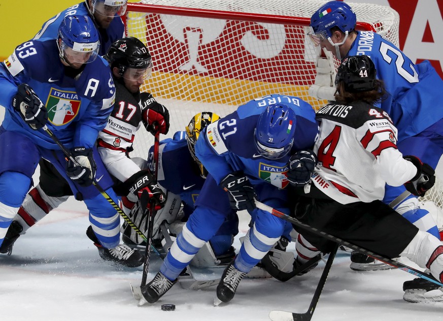 epaselect epa09237138 Justin Danforth (3-L) of Canada in action during the IIHF Ice Hockey World Championship 2021 group B match between Italy and Canada at the Arena Riga, Latvia, 30 May 2021. EPA/TO ...