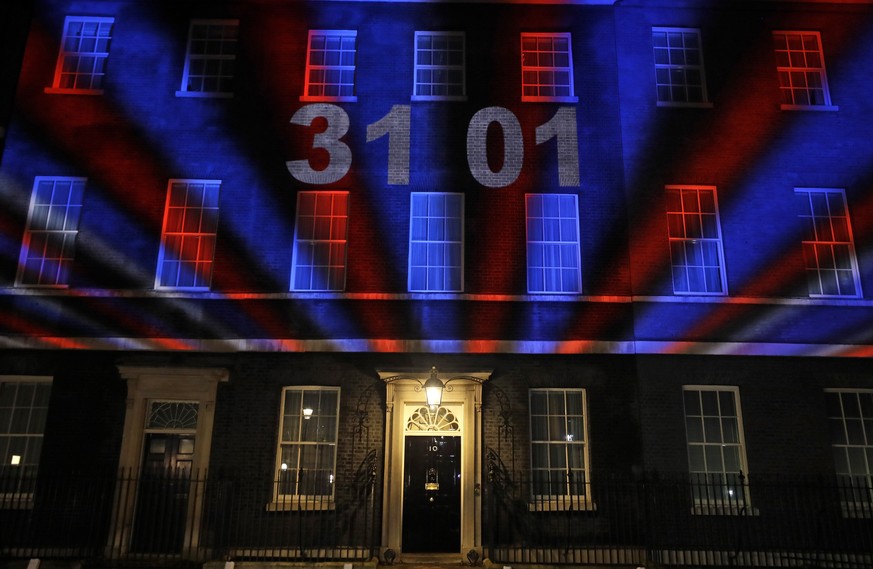 A countdown to Brexit timer and the colors of the British Union flag illuminate the exterior of 10 Downing street, the residence of the British Prime Minister, in London, England, Friday, Jan. 31, 202 ...