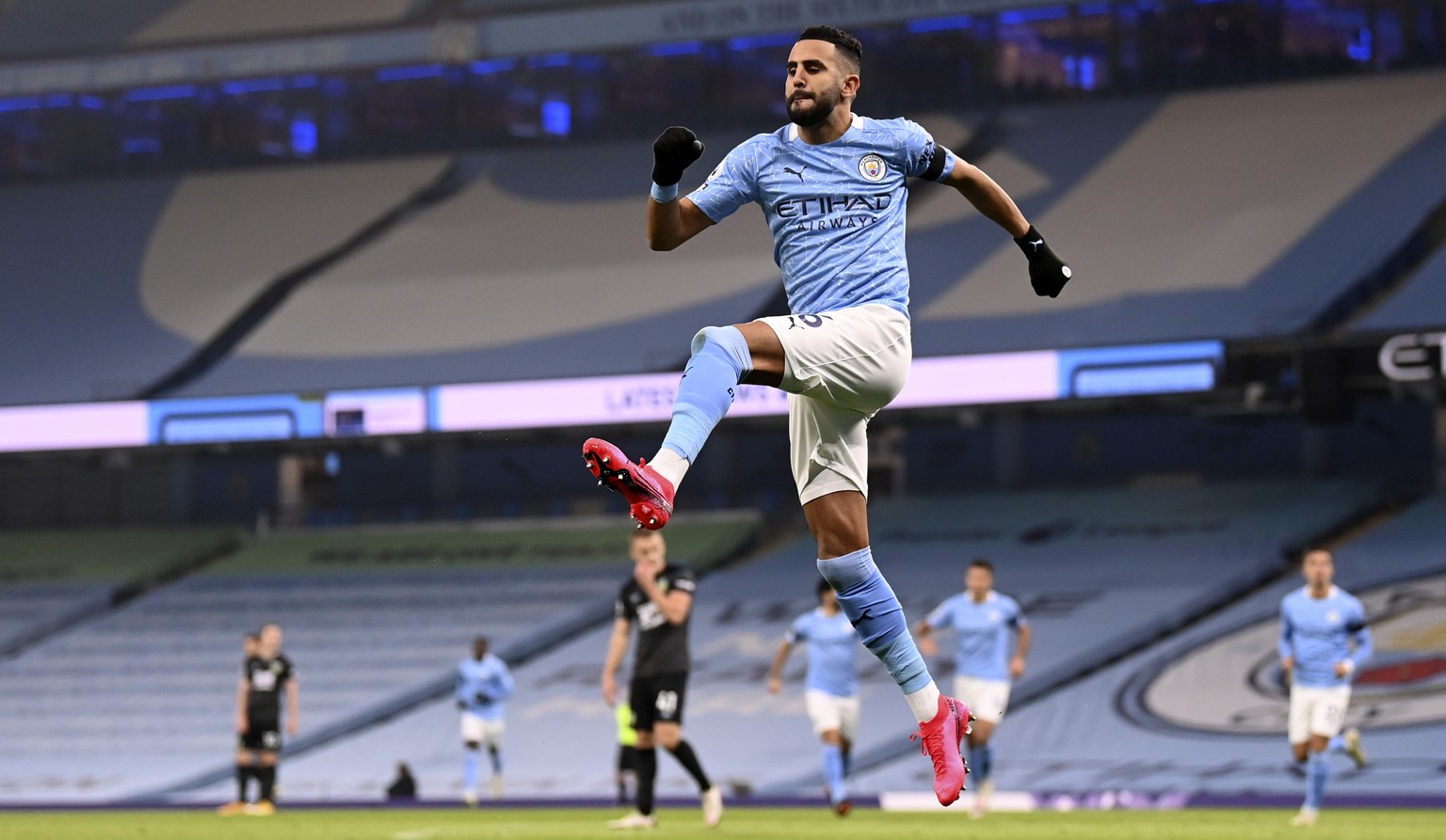 Manchester City&#039;s Riyad Mahrez celebrates after scoring his side&#039;s opening goal during the English Premier League soccer match between Manchester City and Burnley at the Etihad stadium in Ma ...