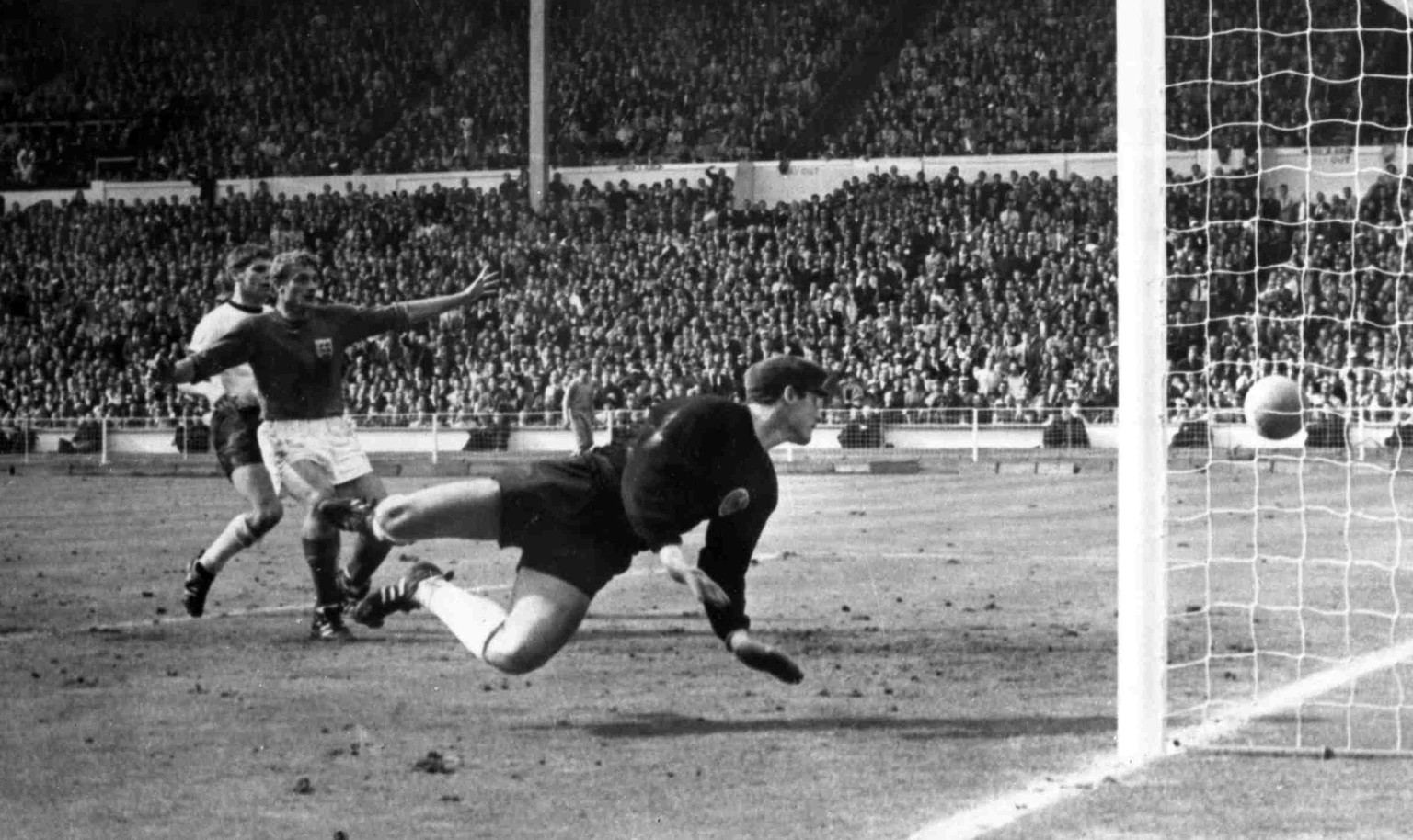 FILE - In this July 30, 1966 file photo, England&#039;s controversial third goal scored by Geoff Hurst, unseen, during the Football World Cup Final at Wembley Stadium, London, as German goalkeeper Han ...