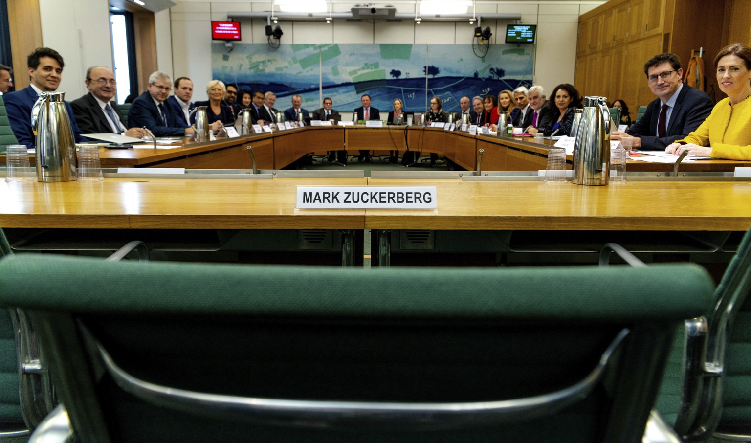 This photo posed for the photographer on Tuesday Nov. 27, 2018 and made available by the House of Commons shows the International Grand Committee with representation from 9 Parliaments and Mark Zucker ...