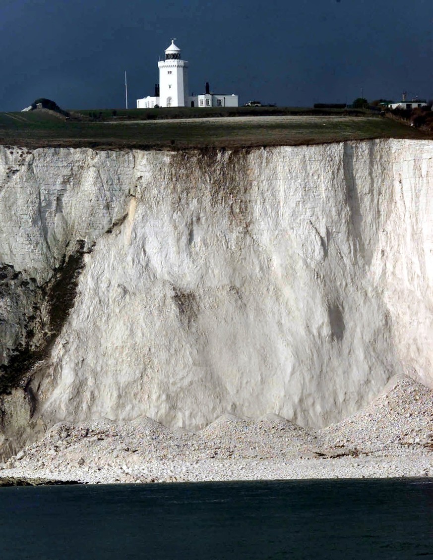 A large segment of chalk lies at the foot of the famed white cliffs of Dover beneath South Foreland lighthouse after a landslip, Thursday, February 1, 2001. The 300 foot, 90 Meter, slip which occured  ...