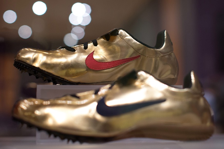 epa05355540 The Nike Michael Johnson Gold Shoes, worn by US sprinter Michael Johnson in the 1996 Olympics, sit on display at the High Museum&#039;s new exhibit, &#039;Out of the Box: Rise of the Sneak ...