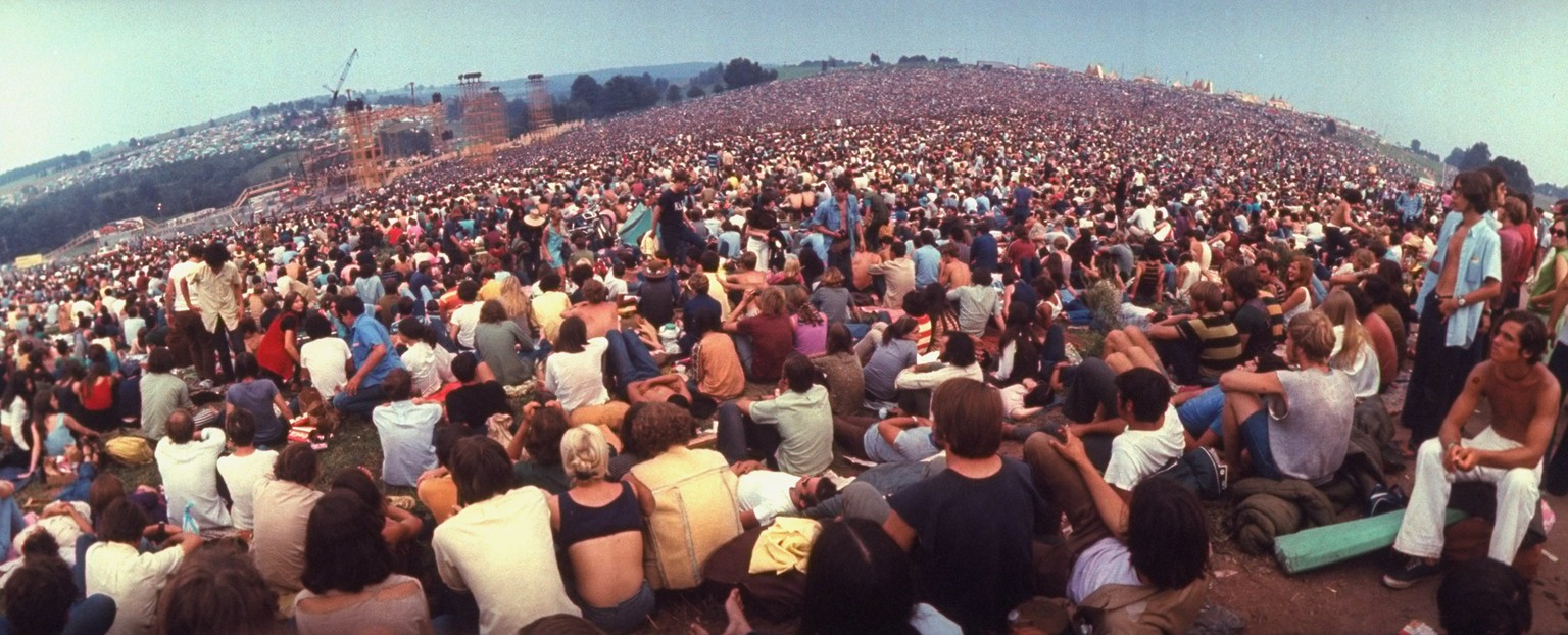 Wide-angle overall of huge crowd facing the distant stage, during the Woodstock Music &amp; Art Fair. (Photo by John Dominis/The LIFE Picture Collection via Getty Images)