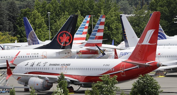 Dozens of grounded Boeing 737 MAX airplanes crowd a parking area adjacent to Boeing Field Thursday, June 27, 2019, in Seattle. A new software problem has been found in the troubled Boeing 737 Max that ...