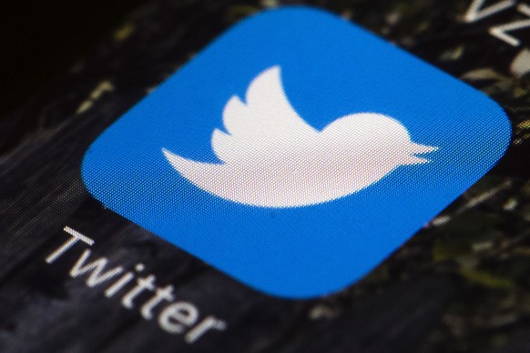 FILE - In this April 26, 2017, file photo is a Twitter app icon on a mobile phone in Philadelphia. Twitter is giving Rep. Marjorie Taylor Greene a 12-hour timeout, saying some of her tweets violated i ...