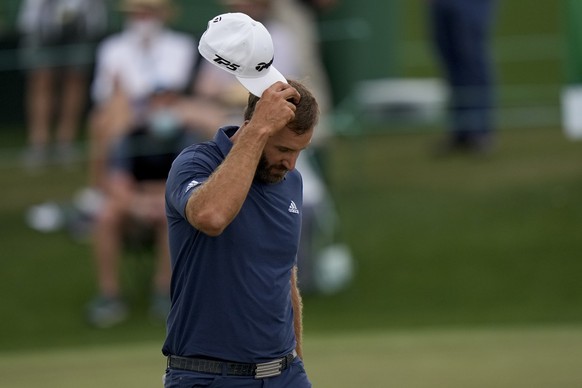 Dustin Johnson walks on the 18th green during the second round of the Masters golf tournament on Friday, April 9, 2021, in Augusta, Ga. (AP Photo/Matt Slocum)