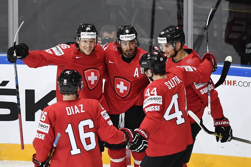 Switzerland&#039;s Rafael Diaz, Damien Brunner, Andres Ambuehl, Pius Sutter and Reto Schaeppi, from left, celebrate their score to 1:0 during their Ice Hockey World Championship group B preliminary ro ...