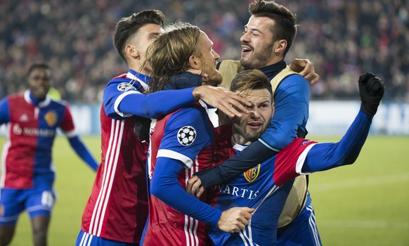 Basel&#039;s Michael Lang, center, celebrates with his teammates the first goal during the UEFA Champions League Group stage Group A matchday 5 soccer match between Switzerland&#039;s FC Basel 1893 an ...