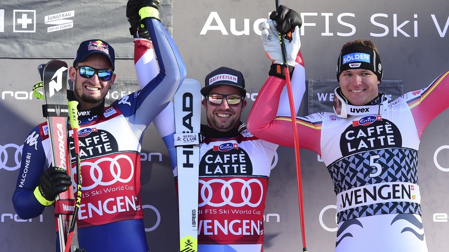 From left, second placed Italy&#039;s Dominik Paris, first placed Switzerland&#039;s Beat Feuz, , and third placed Germany&#039;s Thomas Dressen celebrate at the end of their alpine ski, World Cup men ...