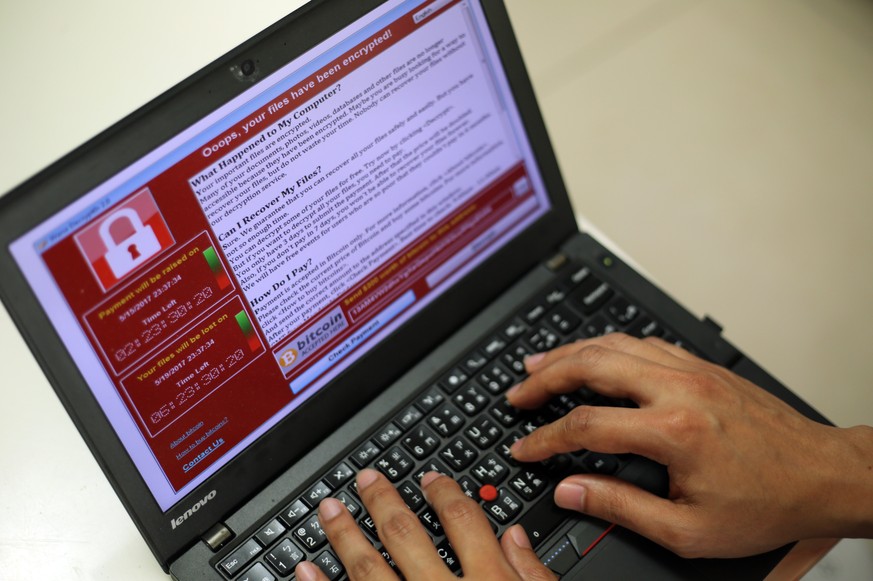 epa05960673 A programer shows a sample of a ransomware cyberattack on a laptop in Taipei, Taiwan, 13 May, 2017. According to news reports, a &#039;WannaCry&#039; ransomware cyber attack hits thousands ...