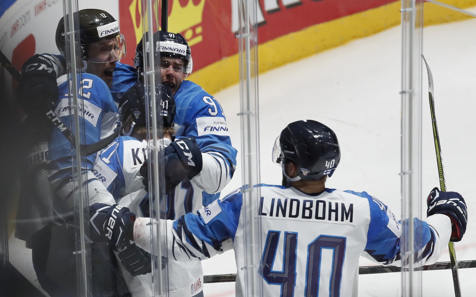 Finland&#039;s Marko Antilla, left, celebrates with teammates after scoring his sides first goal during the Ice Hockey World Championships semifinal match between Russia and Finland at the Ondrej Nepe ...