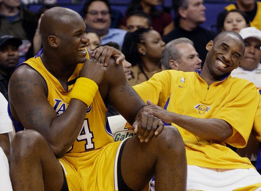 FILE - In this April 15, 2003, file photo, Los Angeles Lakers Shaquille O&#039;Neal, left, and Kobe Bryant share a laugh on the bench while their teammate take on the Denver Nuggets during the fourth  ...
