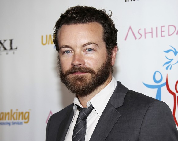 FILE - In this March 24, 2014 file photo, actor Danny Masterson arrives at the Youth for Human Rights International Celebrity Benefit in Los Angeles. Netflix says it has written Masterson out of the c ...