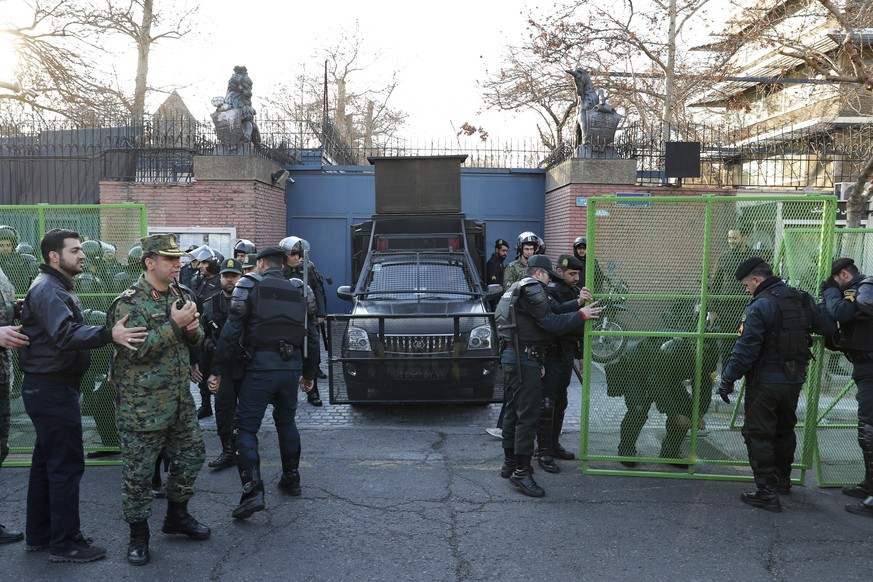 Police guard the British Embassy during an anti-UK protest in Tehran, Iran, Sunday, Jan. 12, 2020. Dozens of hard-liners later gathered outside the embassy on Sunday, chanting &quot;Death to England&q ...