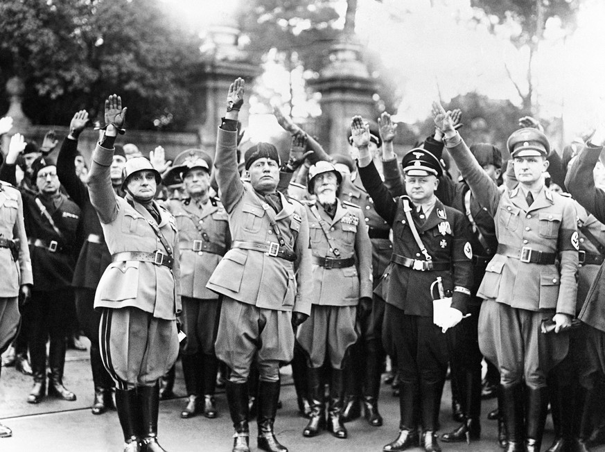 FILE - This Oct. 28, 1936 file photo shows Benito Mussolini, second from left, flanked by Nazis officers on the occasion of the celebration of the fourteenth anniversary of Italian Fascism. Not since  ...